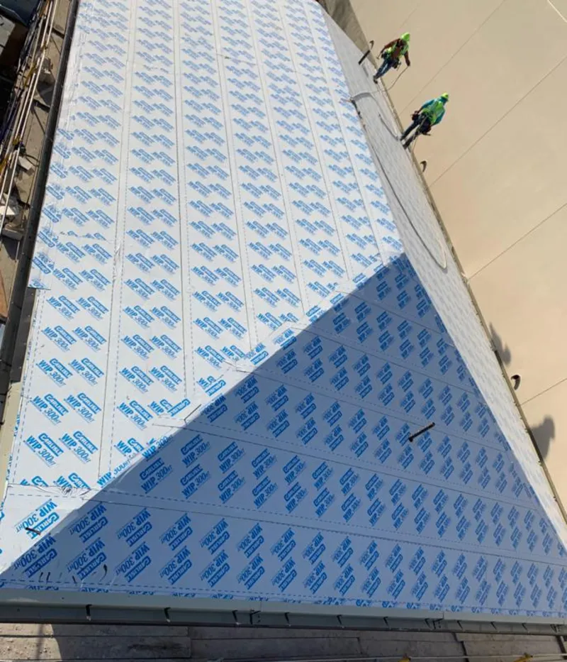 Professional roofers installing underlayment on a metal roof in Gettysburg